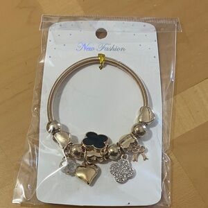 Gold Bracelet with Black Charm